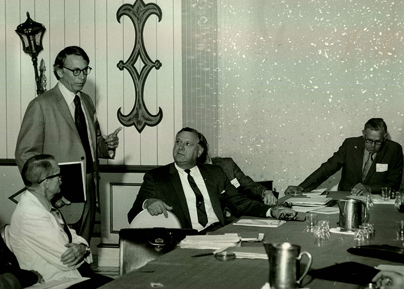 E. G. Hamilton talks to member volunteers at the 1971 Annual Meeting.