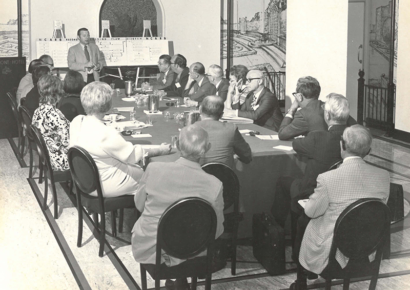 Samuel T. Balen leads a meeting in the 1980s.