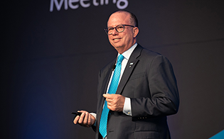 CEO Armstrong speaks in Detroit in 2018